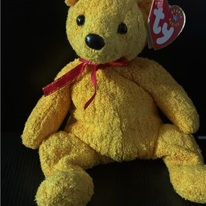 Ty Beanie baby “Poopsie” Ty  Bear with Red Bow